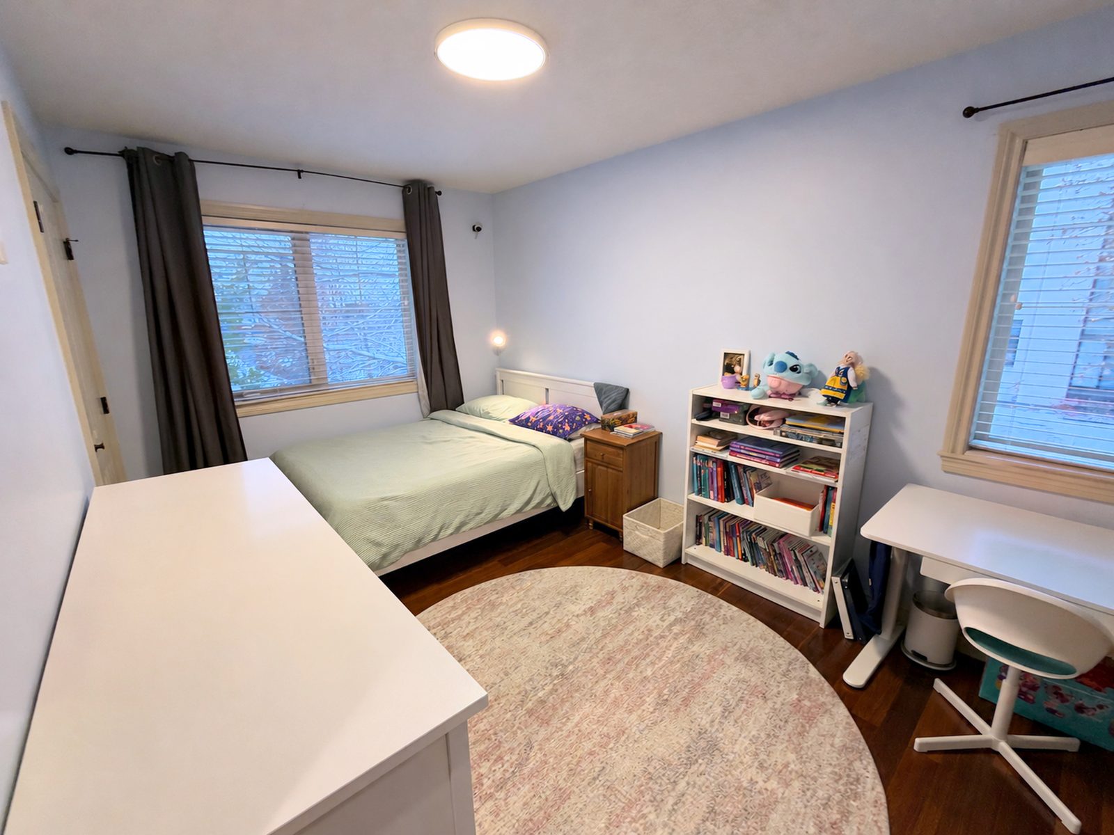Upstairs corner bedroom with two windows