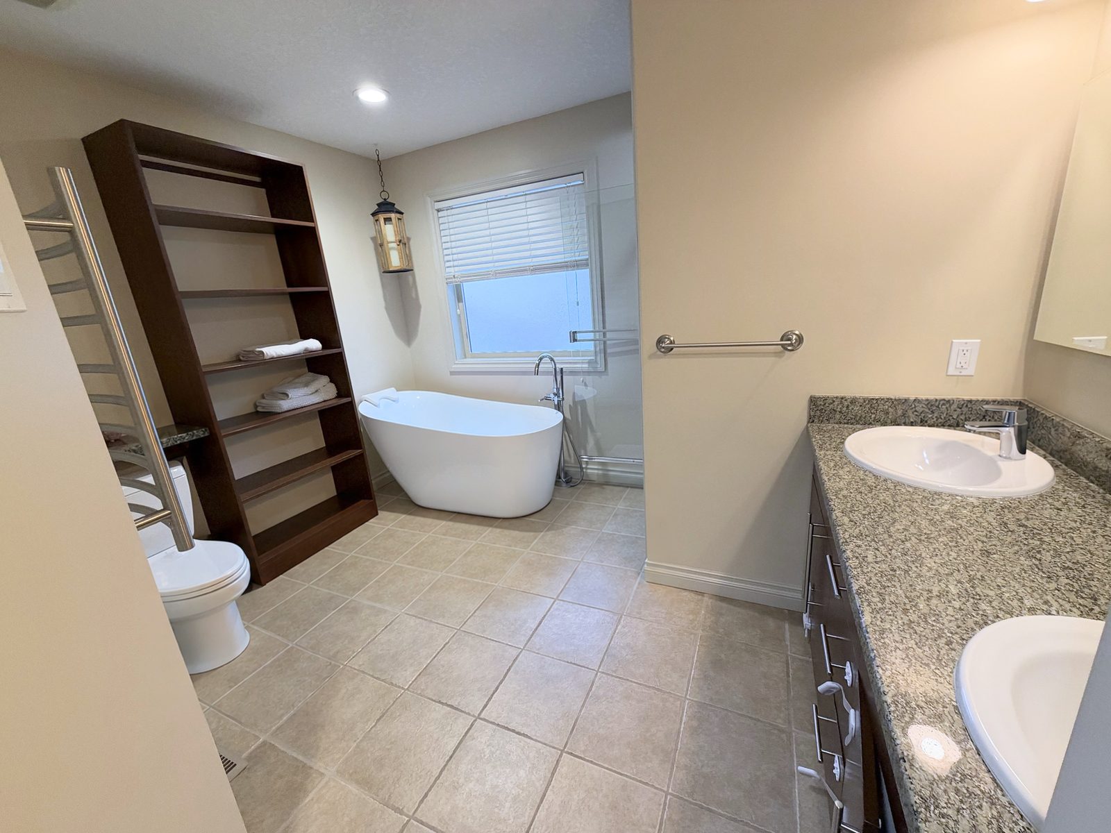 Ensuite with freestanding tub under the window