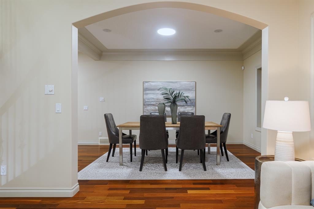 Dining room seen through an arched opening